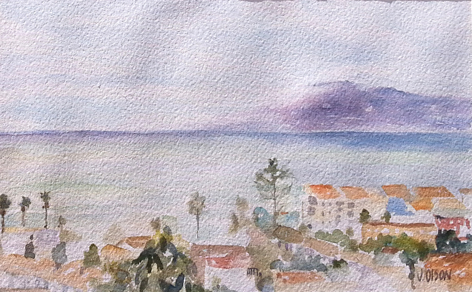 A watercolor of the Medeterranean sea with a cloudy sky and calm blue water the village below