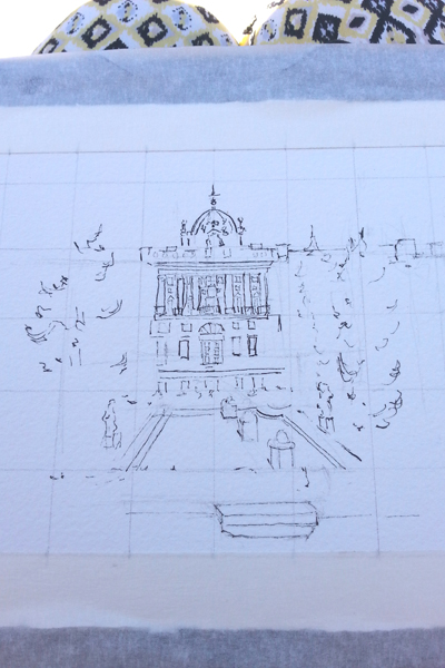 A photo of a white paper taped down with a pen and ink drawing.